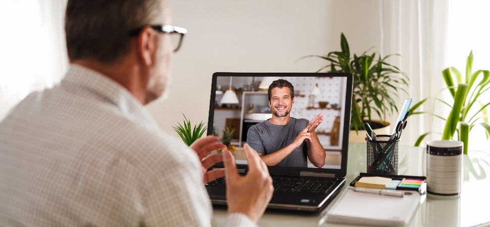 Two professionals having a discussion on a video call