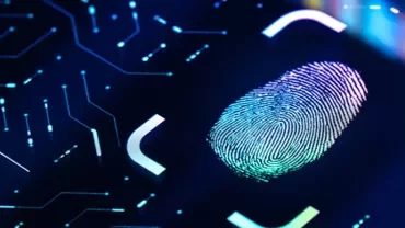 Digital fingerprint on a glowing circuit board background, symbolizing security technology.