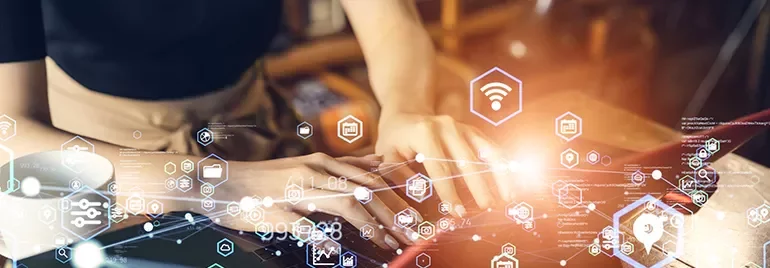 Person typing on a laptop with digital network icons overlayed.