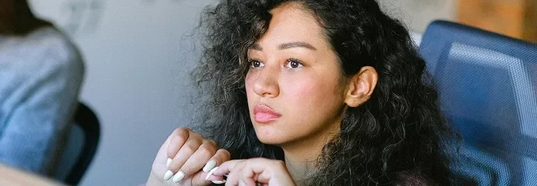 Female professional looking contemplative.