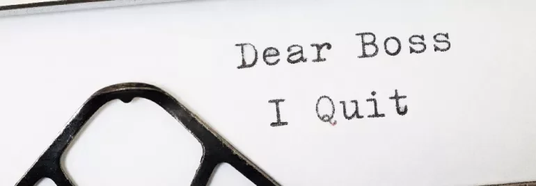 Typewriter with 'Dear Boss I Quit' typed on paper.