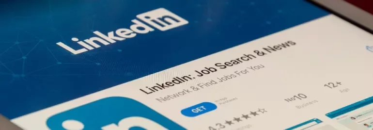 Tablet displaying LinkedIn app download page on a screen.