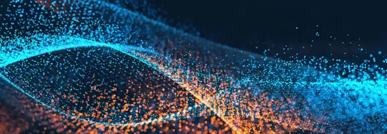 Abstract image of blue and orange particles forming wave-like patterns.