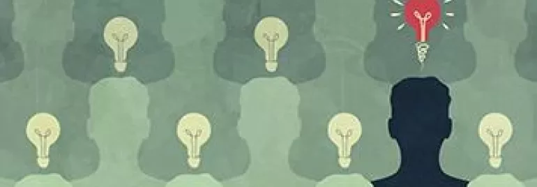 Silhouettes with light bulbs, one glowing red, symbolizing unique ideas.
