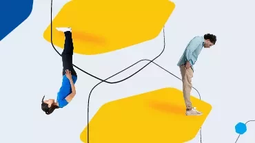 Person standing and another upside down on abstract yellow shapes
