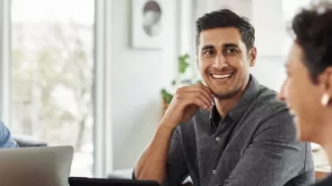 Group of people having a meeting in a bright office.